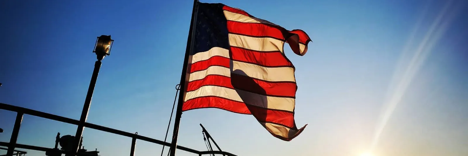 american flag against blue sky